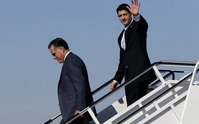 Republican presidential candidate, former Massachusetts Gov. Mitt Romney, followed by his vice presidential running mate, Rep. Paul Ryan, R-Wis., walk off Romney's plane in Cleveland, Ohio on November 6. (photo credit: AP/Charles Dharapak)