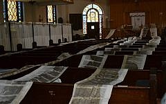 Torah scrolls unfurled and drying post-Sandy at Mazel Day School in Brooklyn's Brighton Beach neighborhood (photo credit: Facebook/JTA)