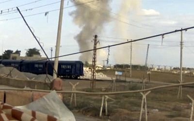 This amateur video provided to AP shows billowing smoke in the Syrian town of Ras al-Ayn, as seen from the Turkish town of Ceylanpinar on Tuesday November 13, 2012 (photo credit: AP Photo/AP Video)