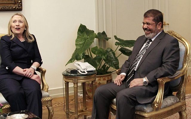 US Secretary of State Hilary Rodham Clinton and Egyptian President Mohammed Morsi meet at the presidential palace in Cairo, Egypt, on July 14, 2012. (Photo credit: Maya Alleruzzo/AP)