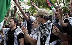Demonstrators in Caracas, Venezuela shout slogans as they protest Israel's military operations in Gaza on Wednesday (photo credit: AP/Ariana Cubillos)