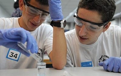 Israeli youth participate a mass chemistry experiment at Tel-Aviv University last year (Photo credit: Gili Yaari/Flash90) Israeli youth participate a mass chemistry experiment at Tel-Aviv University last year (Photo credit: Gili Yaari/Flash90)