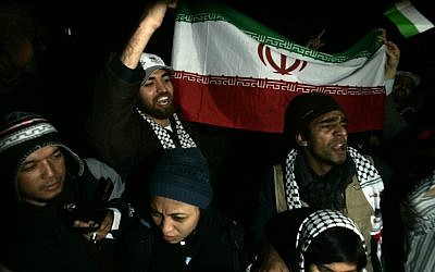 Solidarity activists wave the Iranian flag upon arriving in Gaza, January 03, 2011 (photo credit: Abed Rahim Khatib/Flash90)
