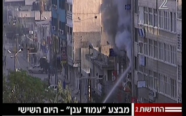 Smoke rises from the Gaza media building attacked by Israel on Monday (photo credit: screen capture/Channel 2) Smoke rises from the Gaza media building attacked by Israel on Monday (photo credit: screen capture/Channel 2)