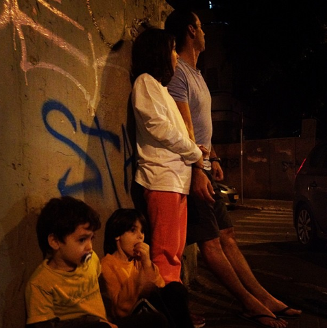A family waiting out a siren in Tel Aviv (Courtesy Nemera/Instagram)
