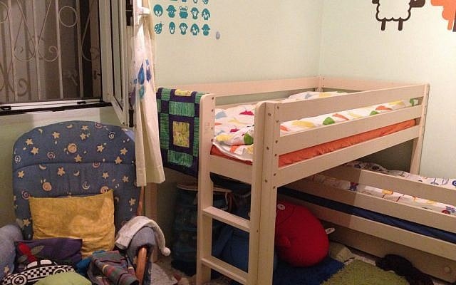 A safe room being used as a kids' bedroom (photo credit: Jessica Steinberg/Times of Israel)