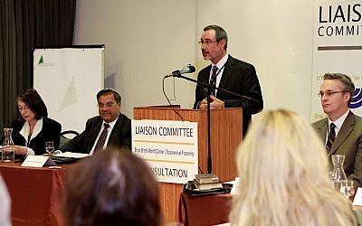 Alan Schneider, the director of the Bnai Brith World Center in Jerusalem, speaking at the opening session of an interfaith consultation outside Jerusalem. To his left is Rev. Paul Wilkinson, to his right are Rabbi Shlomo Riskin and Petra Heldt, the director of the Ecumenical Theological Research Fraternity in Israel (photo credit: Yehoshua Deston)
