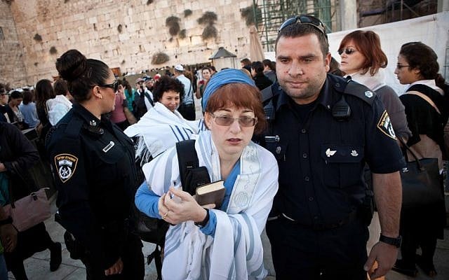 A woman arrested for wearing a prayer shawl at the Western Wall on Thursday (photo credit: courtesy Woman of the Wall) A woman arrested for wearing a prayer shawl at the Western Wall on Thursday (photo credit: courtesy Woman of the Wall)
