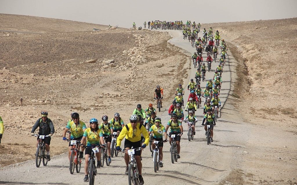 The 2012 Wheels of Love participants ride through Israel's desert (photo credit: courtesy ALYN) The 2012 Wheels of Love participants ride through Israel's desert (photo credit: courtesy ALYN)