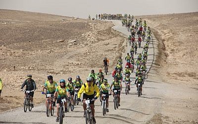The 2012 Wheels of Love participants ride through Israel's desert (photo credit: courtesy ALYN)