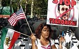 A woman protests against Iranian President Mahmoud Ahmadinejad outside the United Nations building in New York, May 2009 (photo credit: CC BY david_shankbone, Flickr)