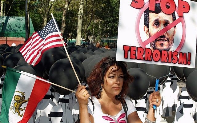 A woman protests against Iranian President Mahmoud Ahmadinejad outside the United Nations building in New York, May 2009 (photo credit: CC BY david_shankbone, Flickr)