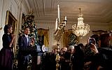 Barack Obama and his wife Michelle at a Hanukkah menorah lighting ceremony in the White House in 2010. (photo credit: Pete Souza/White House via Flickr)