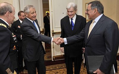 Former senator Chuck Hagel (left) shakes hands with Secretary of Defense Leon E. Panetta in May 2012. (photo credit: CC BY Glenn Fawcett, DoD, Flickr)