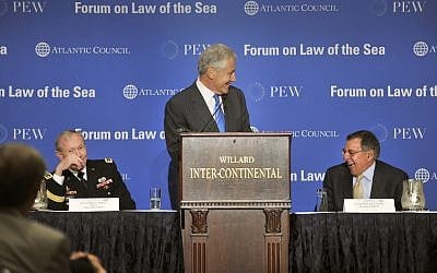 Chuck Hagel, at podium, speaking at a conference in May. (photo credit: Glenn Fawcett/Department of Defense)