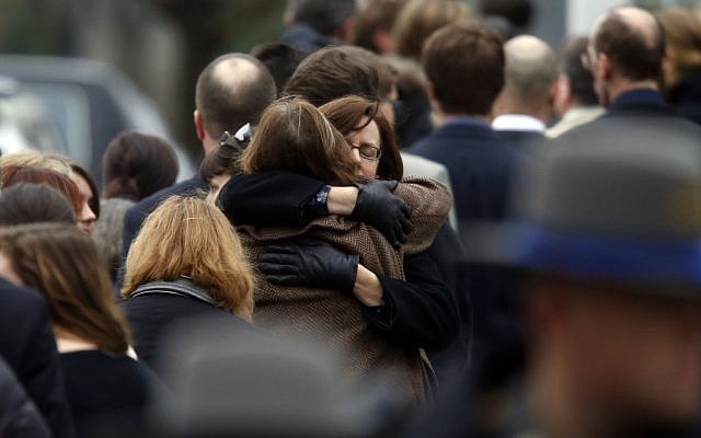 Mourners arrive at a funeral service for 6-year-old Noah Pozner on Monday in Fairfield, Conn. (photo credit: AP/Jason DeCrow)