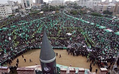 A large model of a M75 long-range missile is seen as hundreds of thousands attend a rally to commemorate the 25th anniversary of the Hamas terrorist organization in Gaza city on Saturday (photo credit: AP/Hatem Moussa)