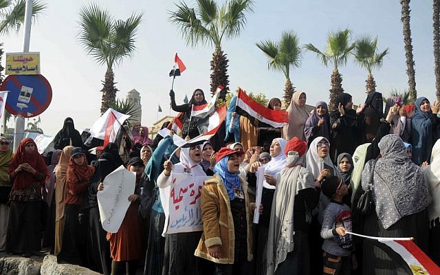 Supporters of Egyptian President Mohammed Morsi rally in front of Cairo University, Cairo, Egypt, Saturday, Dec. 1, 2012 (photo credit: AP/Mohammed Assad)