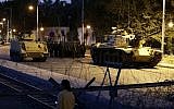 An Egyptian Army tank deploys outside the presidential palace in Cairo on Thursday, December 6, 2012, to control crowds of anti-government protesters (photo credit: AP/Hassan Ammar)