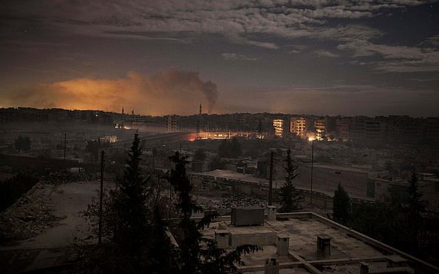Smoke rises from buildings in Aleppo on Saturday due to heavy fighting between Free Syrian Army fighters and government forces. (photo credit: AP/Narciso Contreras)