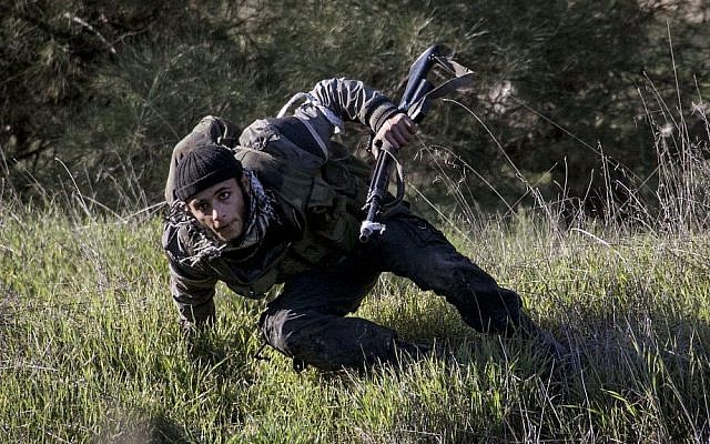 A Syrian rebel fighter takes cover during heavy clashes with government forces north of Aleppo. (photo credit: AP/Narciso Contreras) A Syrian rebel fighter takes cover during heavy clashes with government forces north of Aleppo. (photo credit: AP/Narciso Contreras)