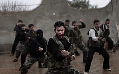 Syrian rebels attend a training session in Maaret Ikhwan, near Idlib, Syria, in December 2012. (photo credit: AP Photo/Muhammed Muheisen)