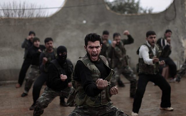 Syrian rebels attend a training session in Maaret Ikhwan, near Idlib, Syria, in December 2012. (photo credit: AP Photo/Muhammed Muheisen) Syrian rebels attend a training session in Maaret Ikhwan, near Idlib, Syria, in December 2012. (photo credit: AP Photo/Muhammed Muheisen)