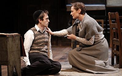 In "My Name Is Asher Lev," an ambivalent Hasidic mother (Jenny Bacon) encourages the title character (Ari Brand) in his talent for painting, but fears the consequences of his non-religious pastime. (Photo credit: Joan Marcus)