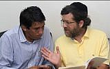 New York businessman Jacob Ostreicher, right, consults with attorney Abel Montano at a courthouse in Bolivia, where he was being held without charges (photo credit: AP/File)