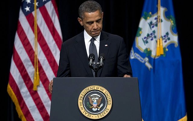 US Pesident Barack Obama pauses during a speech on Dec. 16, 2012. (photo credit: Evan Vucci/AP)