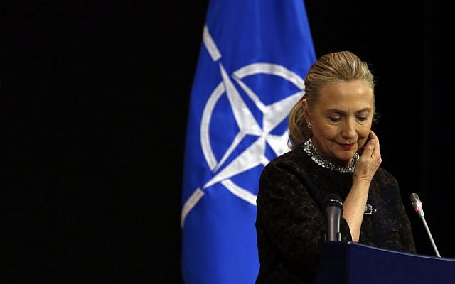 US Secretary of State Hillary Rodham Clinton pauses during a news conference at NATO headquarters in Brussels, Wednesday, December 5. (photo credit: AP/Kevin Lamarque, Pool)