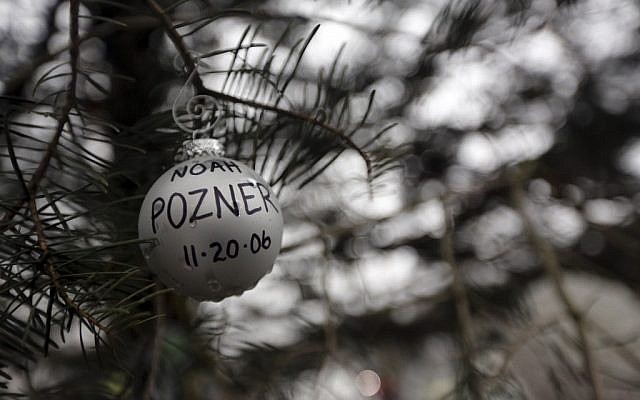 An ornament for Noah Pozner hangs on a tree at one of the makeshift memorials for the Sandy Hook Elementary School shooting, Monday, Dec. 17, 2012 in Newtown, Conn. Pozner was killed when a gunman walked into Sandy Hook Elementary School in Newtown Friday and opened fire, killing 26 people, including 20 children. (Mary Altaffer/AP) An ornament for Noah Pozner hangs on a tree at one of the makeshift memorials for the Sandy Hook Elementary School shooting, Monday, Dec. 17, 2012 in Newtown, Conn. Pozner was killed when a gunman walked into Sandy Hook Elementary School in Newtown Friday and opened fire, killing 26 people, including 20 children. (Mary Altaffer/AP)