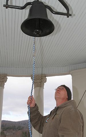 Mike Webb rings the Henderson County Historic Courthouse bell 26 times at 9:31 a.m. on Friday in Hendersonville, N.C., in honor on the victims at Sandy Hook Elementary. (photo credit: AP Photo/The Times-News, Mike Dirks)