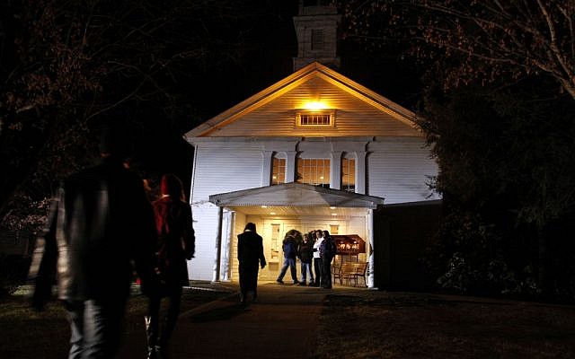 People arrive for a prayer service at Newtown United Methodist Church in the aftermath of a mass shooting at nearby Sandy Hook Elementary School. (photo credit: AP/Jason DeCrow) People arrive for a prayer service at Newtown United Methodist Church in the aftermath of a mass shooting at nearby Sandy Hook Elementary School. (photo credit: AP/Jason DeCrow)