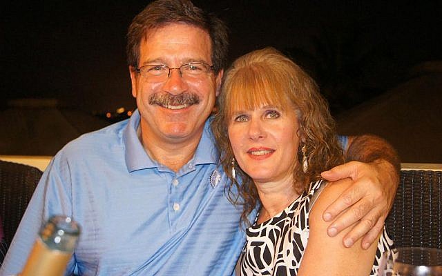 Mark Sherlach and his wife, school psychologist Mary Sherlach, pose for a photo. Mary Sherlach was killed Friday, December 14, when a gunman opened fire at Sandy Hook Elementary School, in Newtown, Connecticut, killing 26 children and adults at the school (photo credit: AP/Courtesy of Mark Sherlach) Mark Sherlach and his wife, school psychologist Mary Sherlach, pose for a photo. Mary Sherlach was killed Friday, December 14, when a gunman opened fire at Sandy Hook Elementary School, in Newtown, Connecticut, killing 26 children and adults at the school (photo credit: AP/Courtesy of Mark Sherlach)
