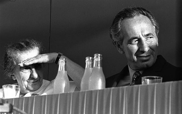 Shimon Peres, right, with Golda Meir (photo credit: GPO)