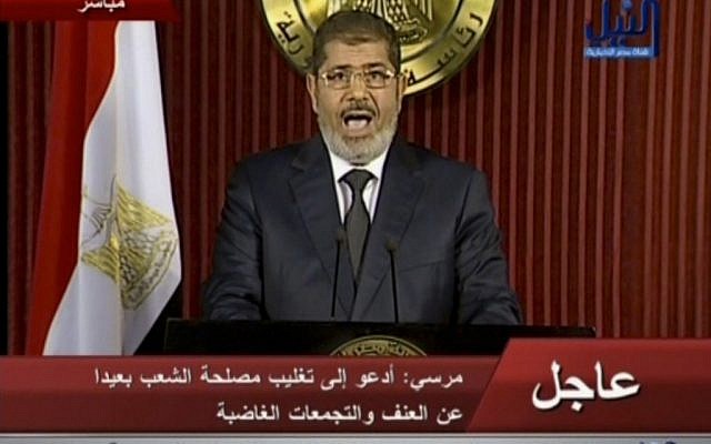 Egyptian President Mohammed Morsi delivers a televised statement in Cairo, Egypt, Thursday, December 6, 2012. (photo credit: AP/Nile TV) Egyptian President Mohammed Morsi delivers a televised statement in Cairo, Egypt, Thursday, December 6, 2012. (photo credit: AP/Nile TV)
