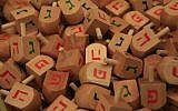 Illustrative photo of dreidels for sale at the Mahane Yehuda market in Jerusalem (photo credit: Nati Shohat/Flash90)