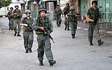 File: Israel Border Police on patrol in Hebron (photo credit: Najeh Hashlamoun/Flash90)