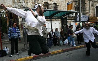 Illustrative: Ultra Orthodox Jewish followers of the Hassidic Breslov sect dance in a Jerusalem street, November 2009 (photo credit: Miriam Alster/Flash90)