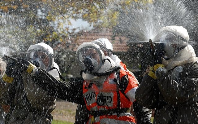 IDF Home Front Command soldiers take part in a 2011 defense drill simulating a chemical attack (Gili Yaari/Flash 90) IDF Home Front Command soldiers take part in a 2011 defense drill simulating a chemical attack (Gili Yaari/Flash 90)