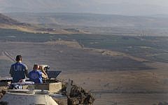 UN peacekeepers monitor the Syrian side of the Israeli-Syrian border from an army post at Mount Bental in the Golan Heights last July (photo credit: Tsafrir Abayov/Flash90)