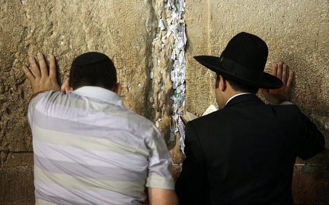 Jewish worshippers pray at Jerusalem's Western Wall (photo credit: Yoav Ari Dudkevitch/Flash90)