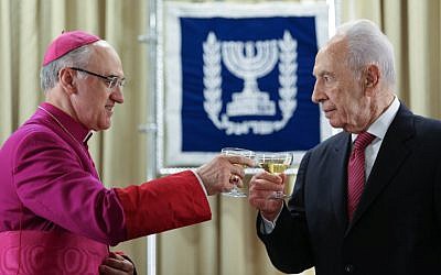 President Shimon Peres (right) greets incoming Vatican envoy to Israel, Giuseppe Lazzarotto on Tuesday, December 4. (photo credit: Oren Nahshon/Flash90)