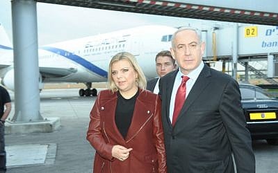 Prime Minister Benjamin Netanyahu and his wife Sara make their way to Prague on Wednesday, December 5. (photo credit: Amos Ben Gershom/GPO/Flash90)