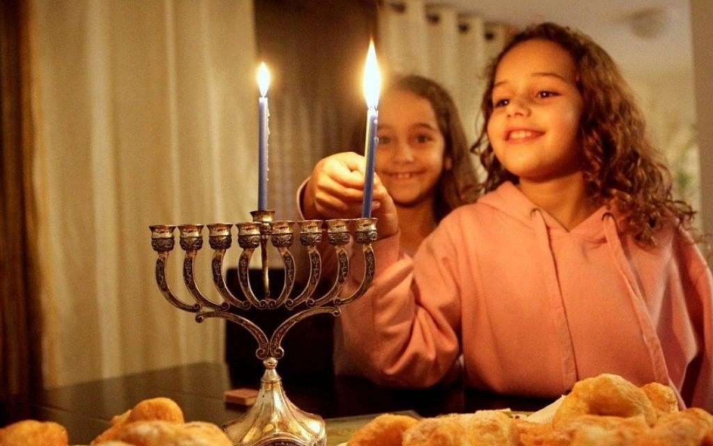 Lighting Hanukkah candles in Jerusalem (photo credit: Edi Israel/Flash90) Lighting Hanukkah candles in Jerusalem (photo credit: Edi Israel/Flash90)