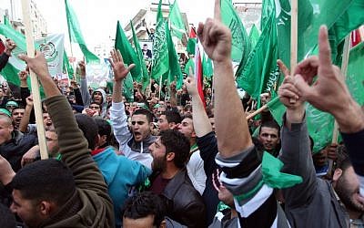 Palestinian supporters of Hamas at a rally marking the terrorist organization's 25th anniversary in the West Bank city of Ramallah, December 15, 2012 (photo credit: Issam Rimawi/Flash90)