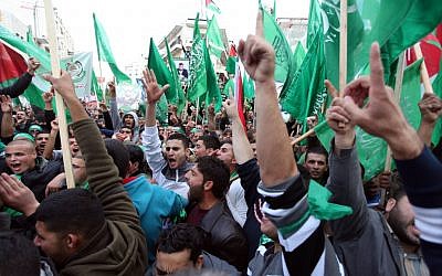 Palestinian supporters of Hamas attend a rally marking the 25th anniversary of the Islamist movement's foundation in the West bank town of Ramallah, December 14, 2012 (photo credit: Issam Rimawi/Flash90)