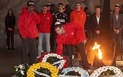 Israeli basketball players visit the Yad Vashem Holocaust memorial on Wednesday, December 19 (photo credit: Isaac Harari/Flash90)