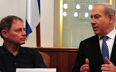 Benjamin Netanyahu (right) and Hagai Hadas speak about illegal migrants in Israel, Sunday (photo credit: Kobi Gideon/Flash90)